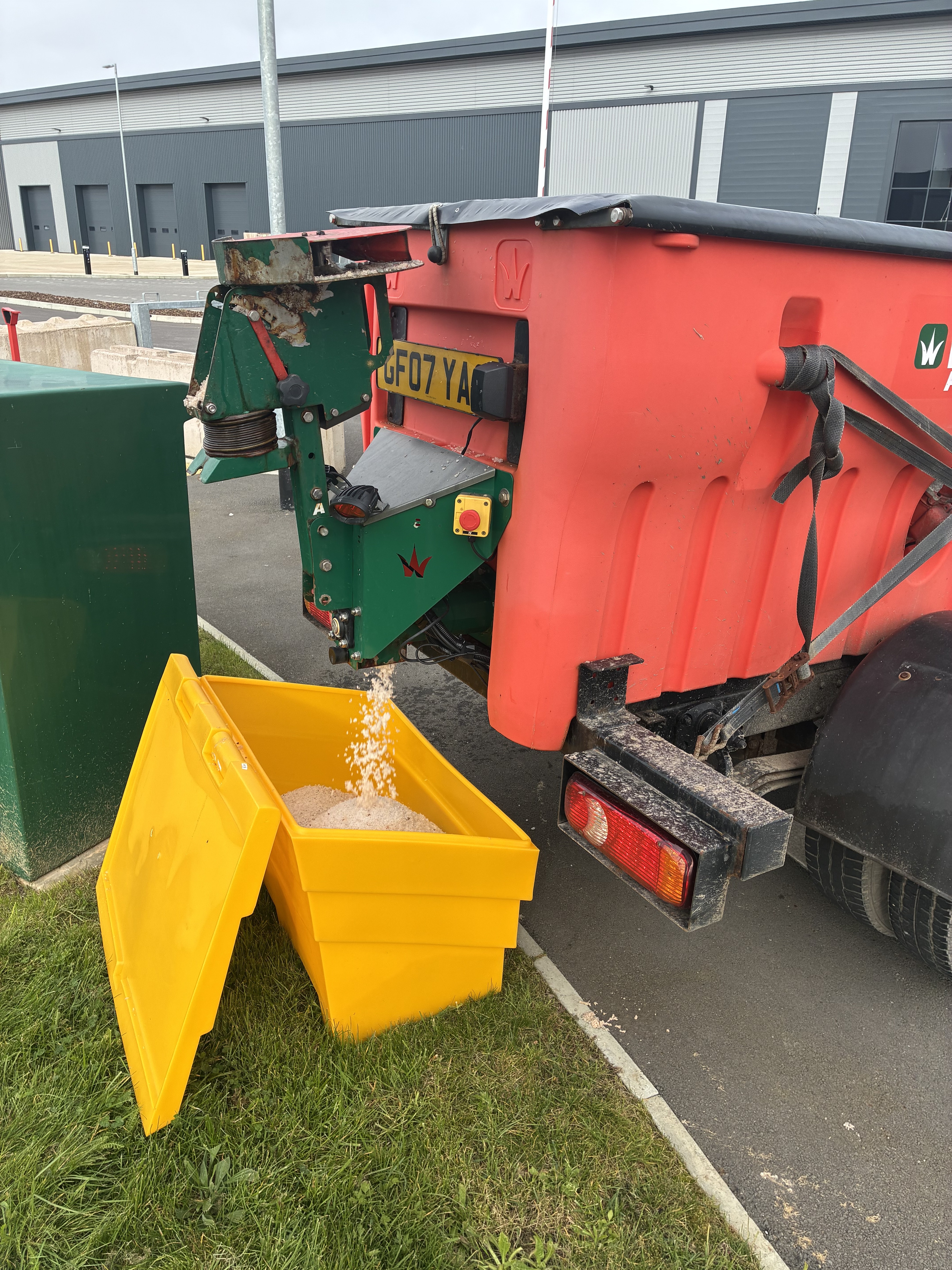 EFP Gritting lorry refilling a yellow grit bin on site